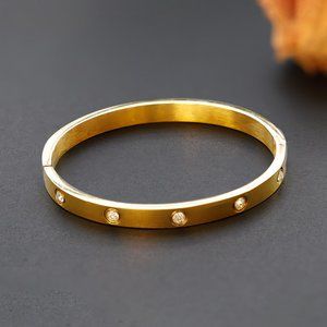 bracelet similar to love bracelet. gold plated